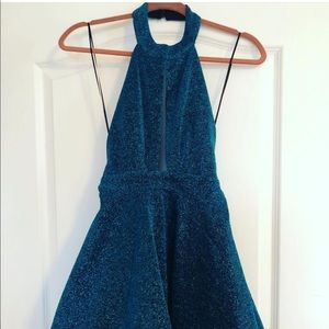 Boutique teal glitter skater dress with open back.